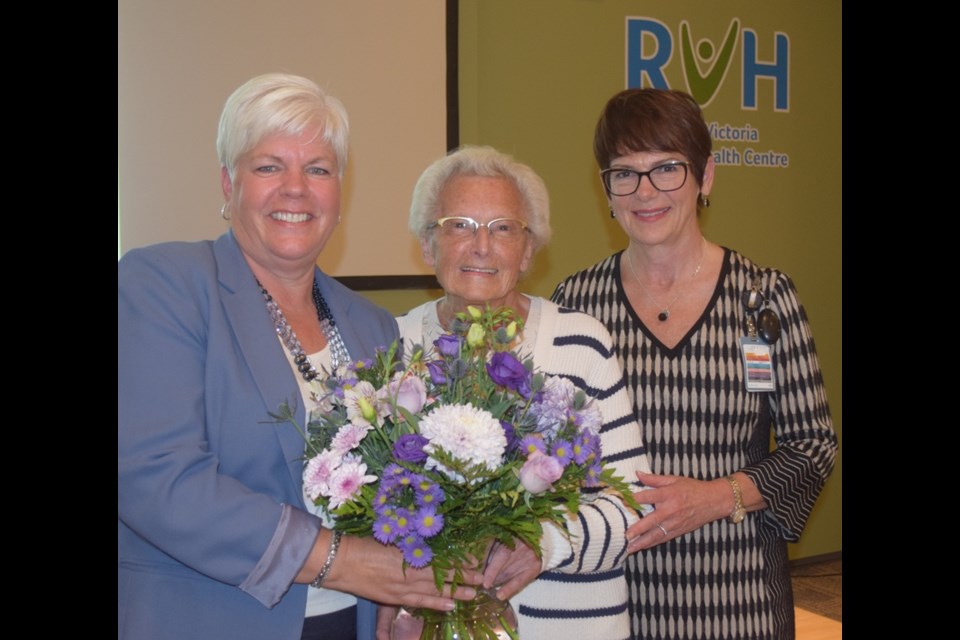 Royal Victoria Regional Health Centre volunteer Mona Taylor (centre) was honoured with the RVH Auxiliary’s Award of Distinction – the highest Auxiliary award. She received her award and a bouquet of flowers from Lise McCourt (left), president, RVH Auxiliary and Janice Skot, RVH president and CEO.