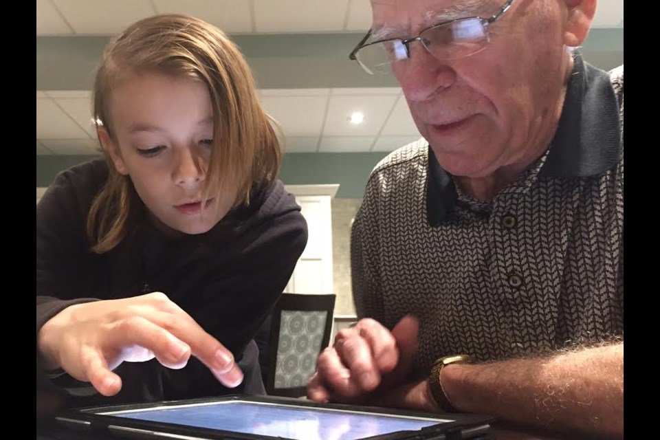 Twelve-year-old Jacob Attwood shows his student Len Knox, 81, how to navigate email on an iPad.
Sue Sgambati/BarrieToday