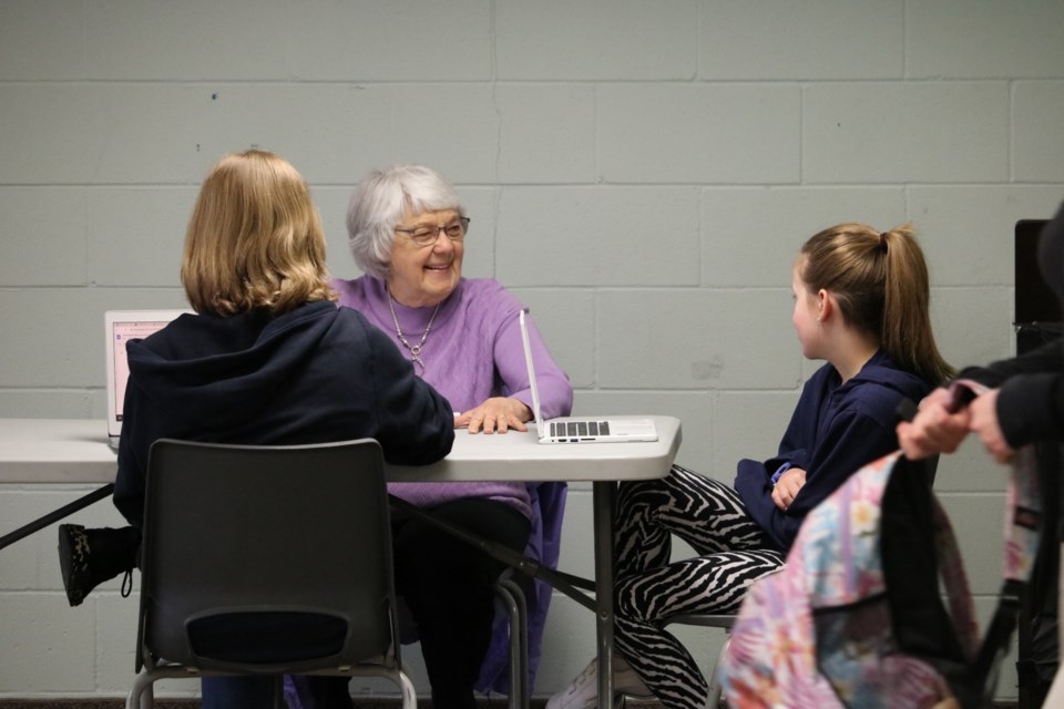 Volunteers with the GrandPals program meet students at a local school once a week to share life stories and develop a mutual respect