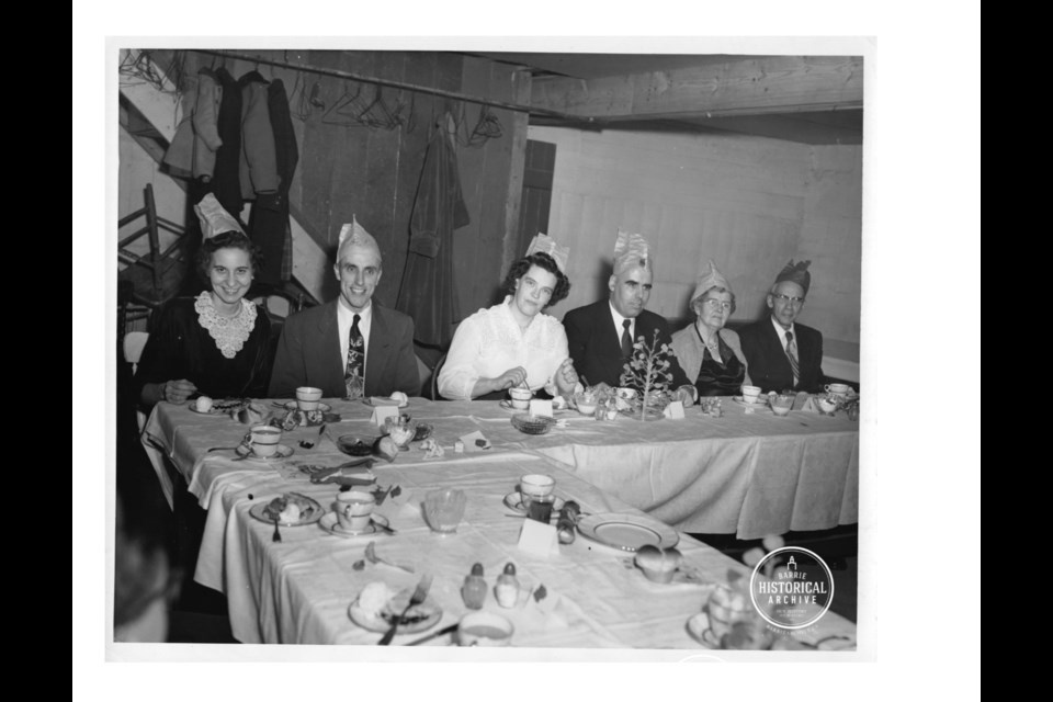 Dessert is served as Mayor Les Cooke attends a community meal. Photo courtesy the Barrie Historical Archive