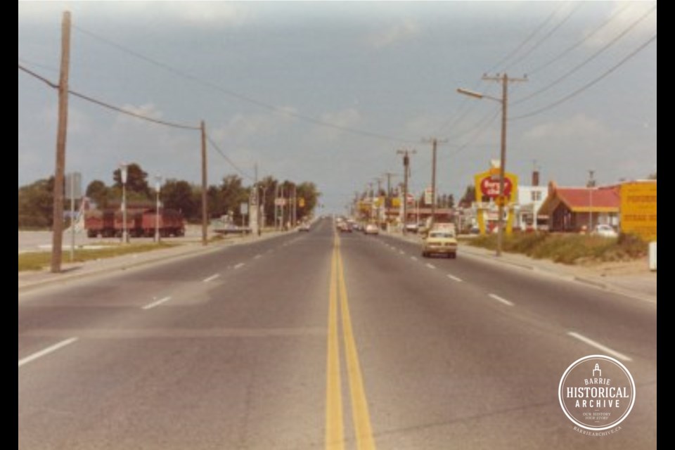 Bayfield Street, looking north from near Coulter Street, around 1975. Red Lobster is located where the yellow Ponderosa sign is on the right.