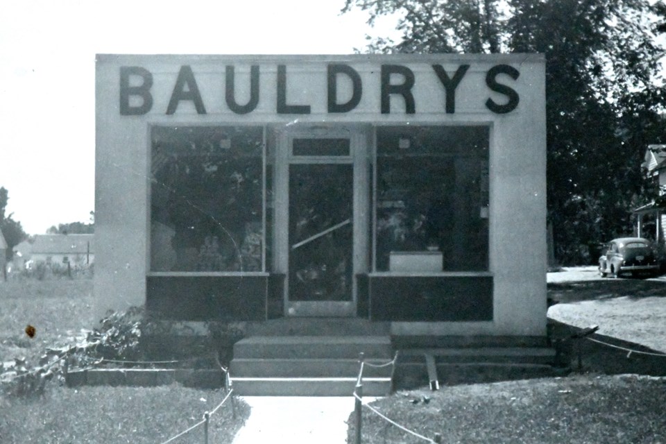Same tiny store but a different spelling from an undetermined date, perhaps early 1950s. Note vehicle at right. 