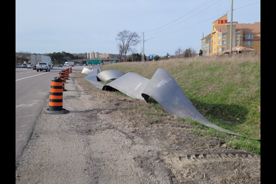 Uncoiled metal was removed from the highway and sat there as late as 7 p.m., Thursday.