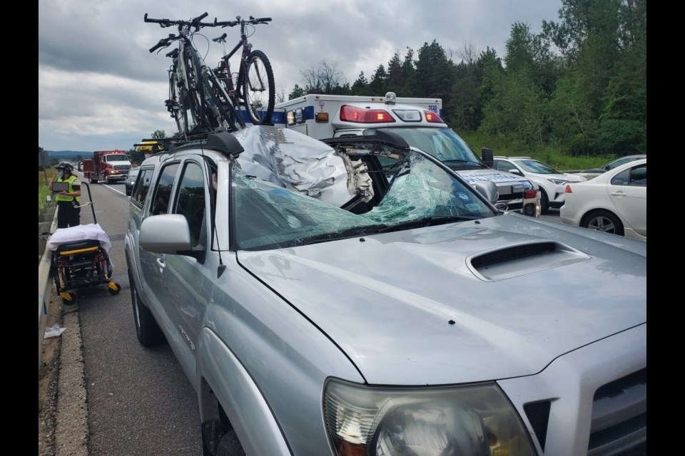 Damage from a wheel flying off a vehicle travelling southbound on Highway 400 at Highway 89 and smashing into the windshield of a vehicle in the northbound lanes on Monday, Aug. 3. OPP Twitter image