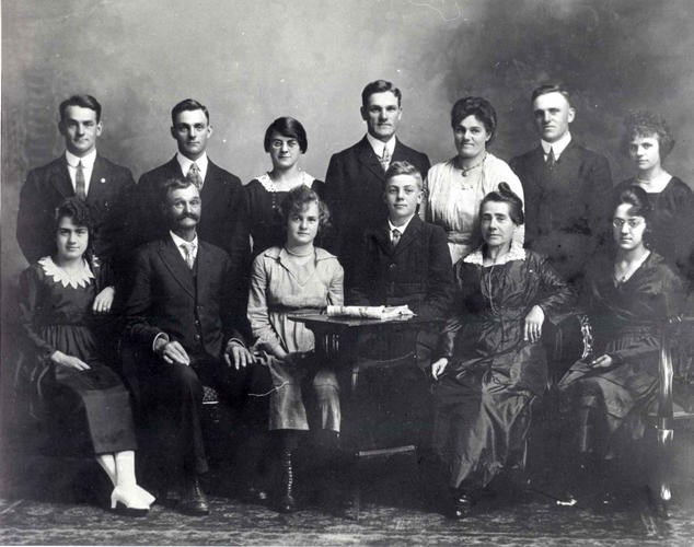 The 11 children of George and Prudence Green in 1917. Josephine, wearing glasses, is seated on the far right. Image courtesy of Innisfil Public Library and Innisfil Historical Society
