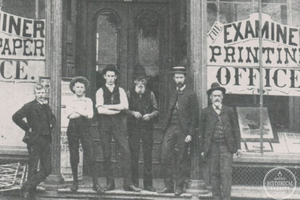 Barrie Examiner staff in front of their Dunlop Street office.