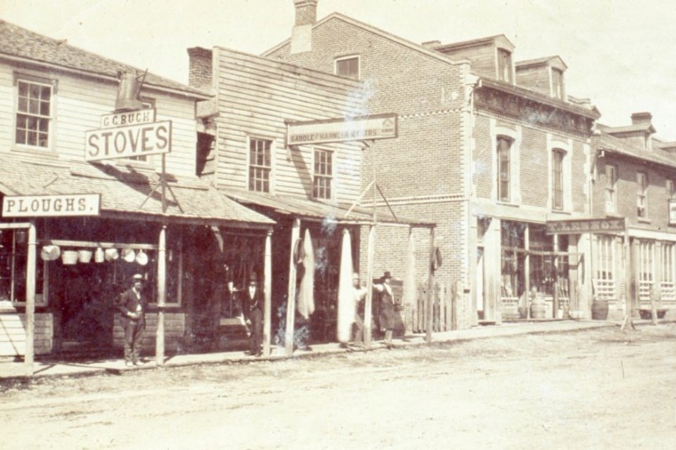 Business buildings, including Thomas Lennox's shop, on Bayfield Street just north of Five Points, before 1876.