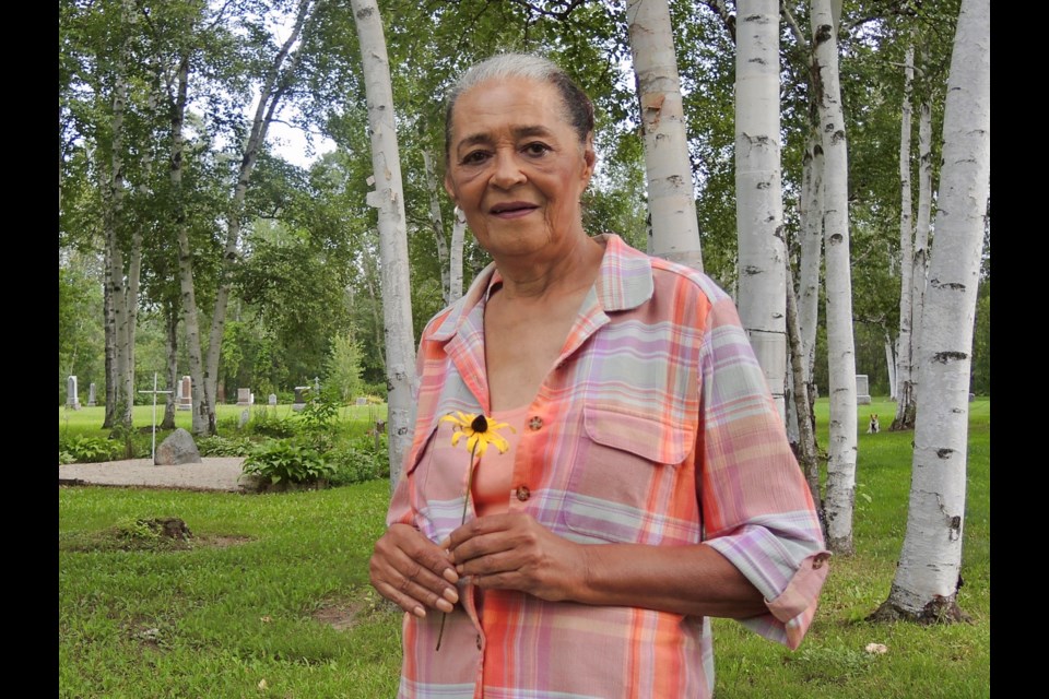 Janie Cooper-Wilson stands in the Bethel-Union Pioneer Cemetery. She's holding a Black-Eyed Susan bloom that was significant to African settlers.
Sue Sgambati/BarrieToday       