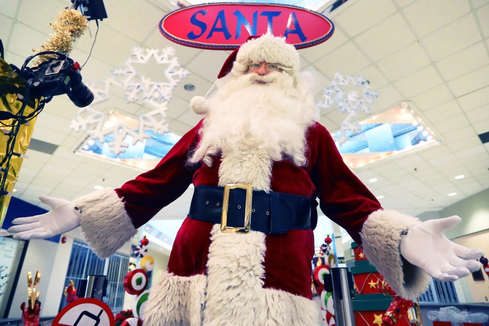 Santa kept himself busy over the weekend as he visited several locations around town including here at the Bayfield Mall on Saturday, Dec. 16, 2017. Kevin Lamb for BarrieToday