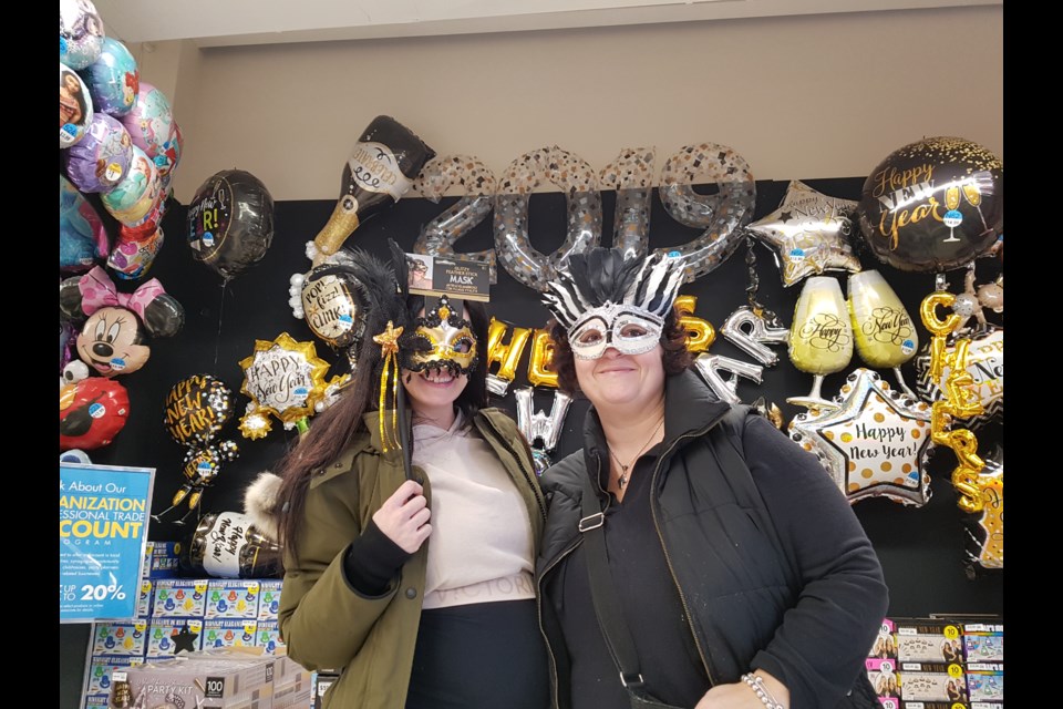 Jenny Mastrolonardo (left) and Tonia Lotta (right) grabbed a bunch of party stuff for a a masquerade event New Year's Eve. Shawn Gibson/BarrieToday 