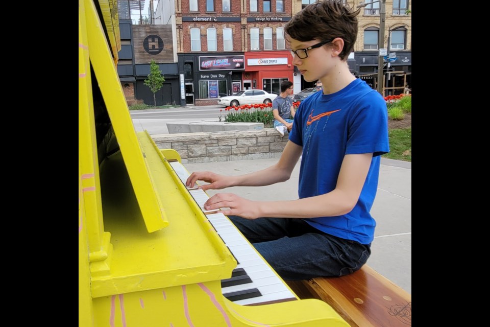 Iain Holla, 14, was excited to see the Downtown Barrie public piano was available at Meridian Place. Saturday, May 22, 2022.