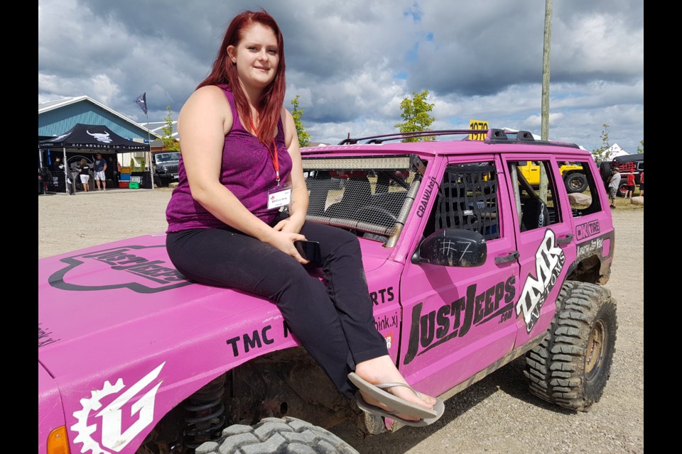 Amanda Brackett shows off her pink 1999 Jeep Cherokee at the Canada Jeep Show on Saturday. Shawn Gibson/BarrieToday