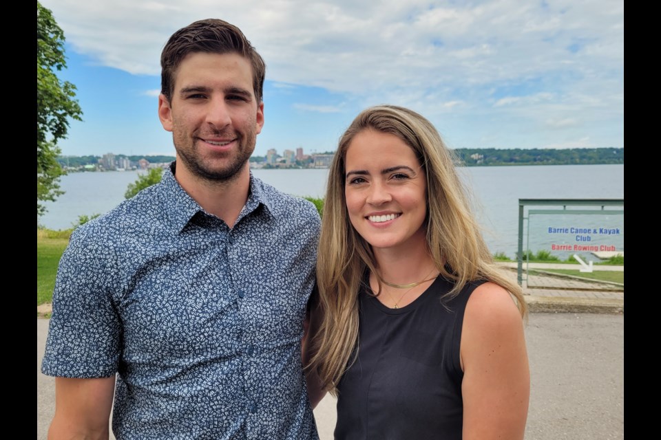 Toronto Maple Leafs captain John Tavares and his wife, Aryne, stand with Kempenfelt Bay behind them during a visit to Barrie on Thursday, July 28.