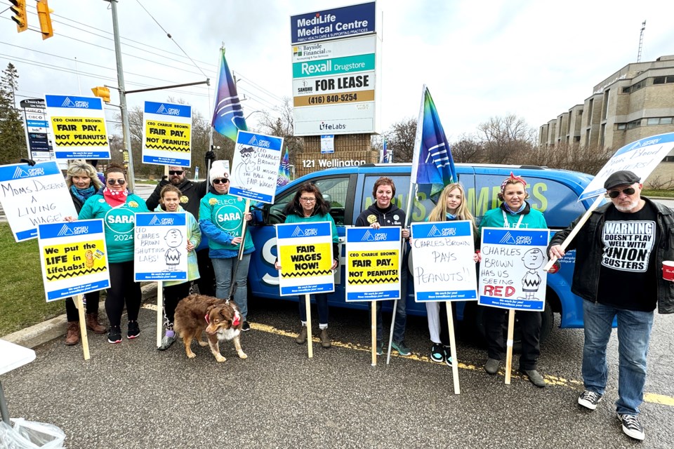 LifeLabs employees, part of OPSEU Local 389, rally at LifeLabs on Wellington Street in Barrie on Saturday, ahead of their May 2 strike deadline.