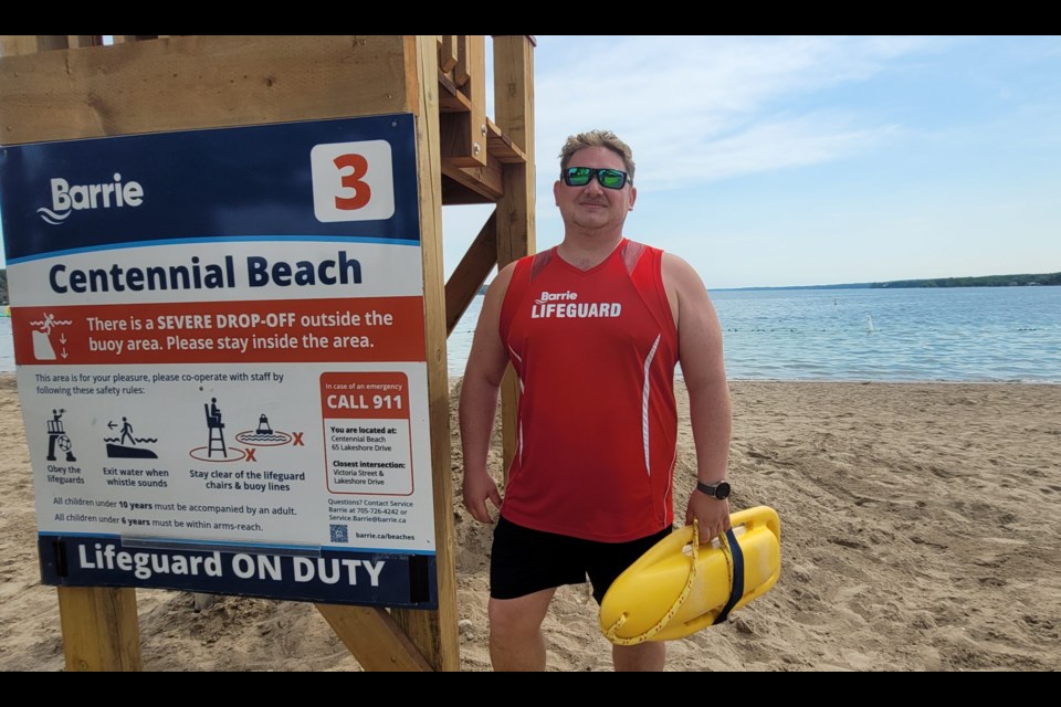 Keegan Durts gets ready to watch over Kempenfelt Bay as the beach season begins for City of Barrie lifeguards.