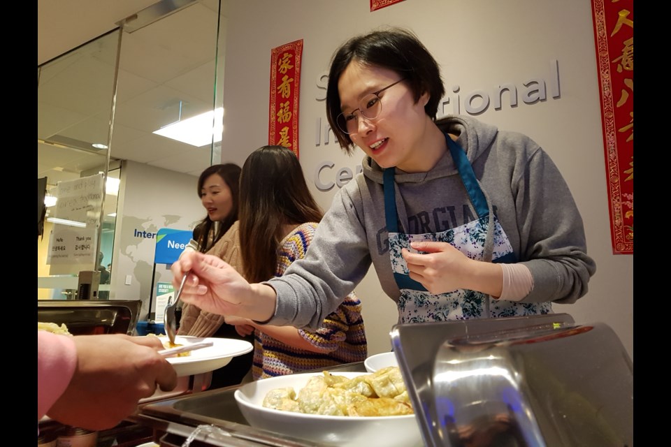 Regina Kim serves up delicious dumplings to the hundreds of students who took part in the Lunar New Year celebrations, Thursday Jan. 23, 2020. Shawn Gibson/BarrieToday