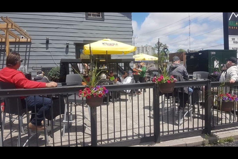 The patio was a lively place at Malones Pint House on Bradford Street, Sunday. Shawn Gibson/BarrieToday 