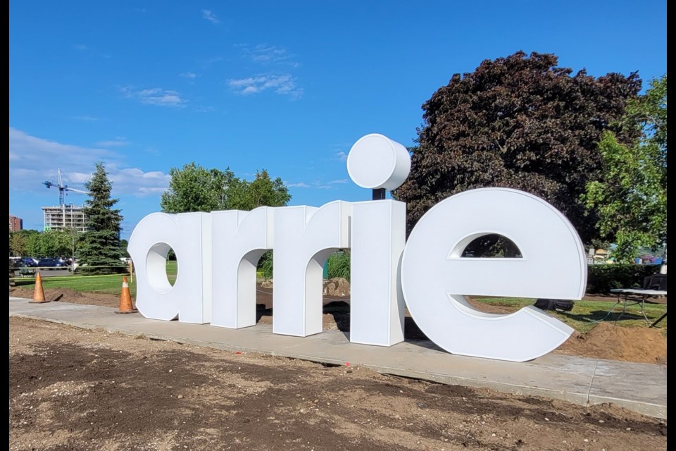 The Heart Barrie sign is being installed at the entrance to Heritage Park.