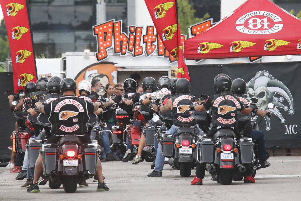 Bikers from the Hells Angels and other clubs gather at a staging area in Newmarket prior their memorial ride for former member Robert Peterson along Highway 404 south to Toronto on Thursday morning.
