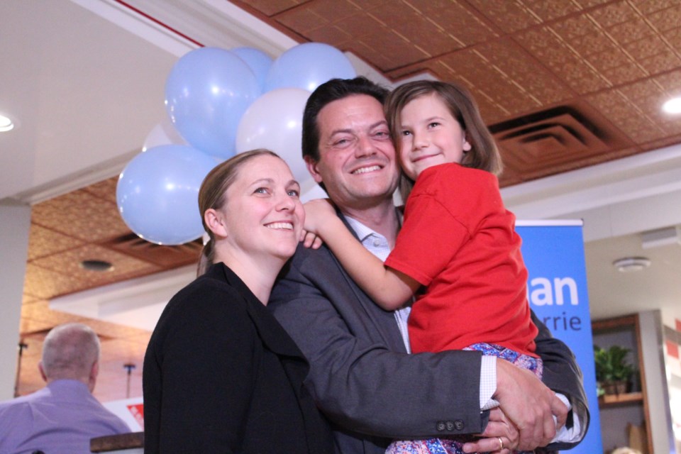 Jeff Lehman celebrates his victory with wife Jennifer and daughter Cassie, Monday night at PIE restaurant along the city's waterfront, after winning his third term as Barrie mayor. Raymond Bowe/BarrieToday