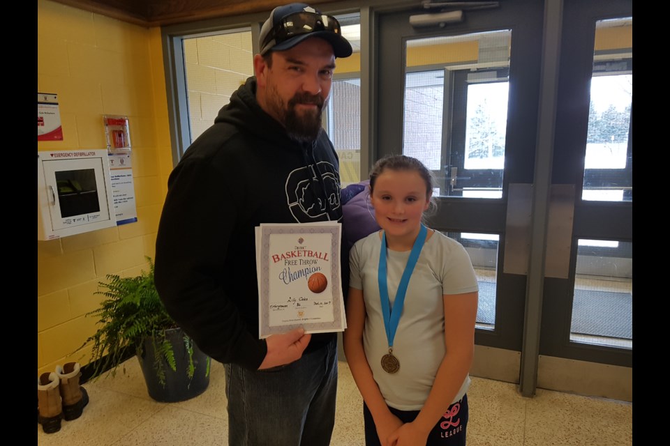 Winner Lily Coles stands with proud dad, Kayne, after Sunday's competition in Barrie. Shawn Gibson/BarrieToday