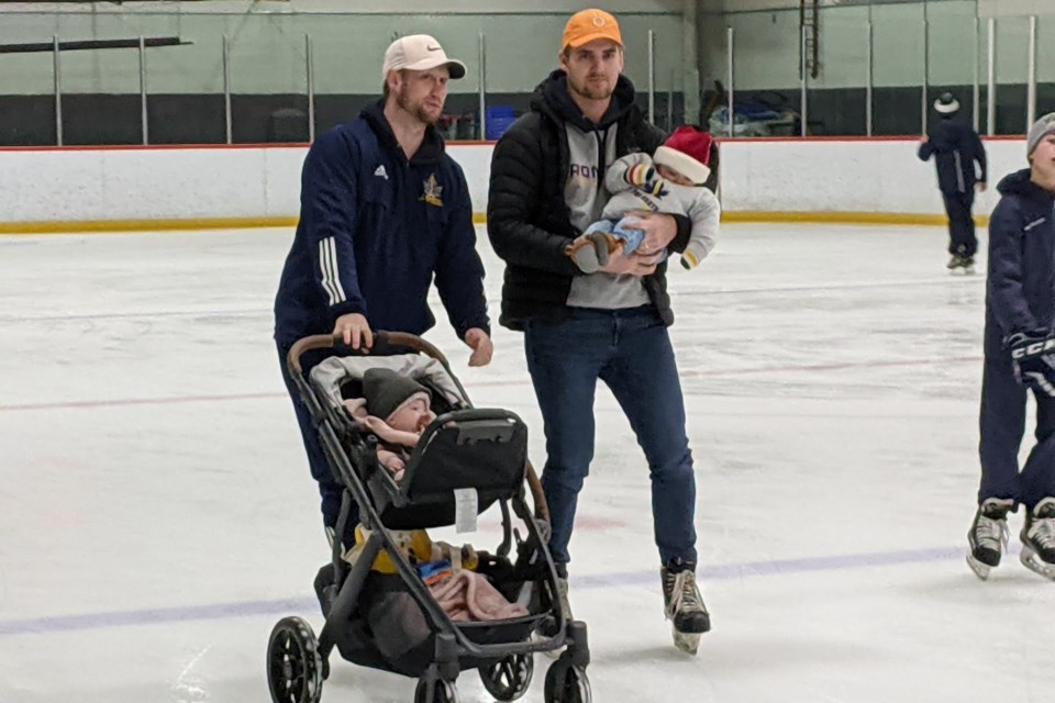 Skating for Youth Haven Sunday are, at left, Ryan Johnson and six-month-old daughter Lucy, and AJ Pieprzak, with Hayes, who’s also six months old.
