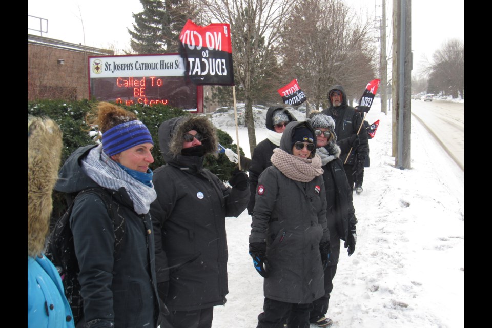 Staff at St. Joseph's Catholic High School in Barrie walk the picket line on Wednesday. Shawn Gibson/BarrieToday