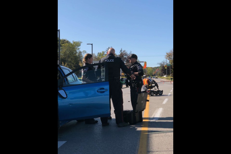 Barrie police were on the scene of a collision at Bayfield and Ross streets between a vehicle and scooter. Photo supplied by Barrie Police
