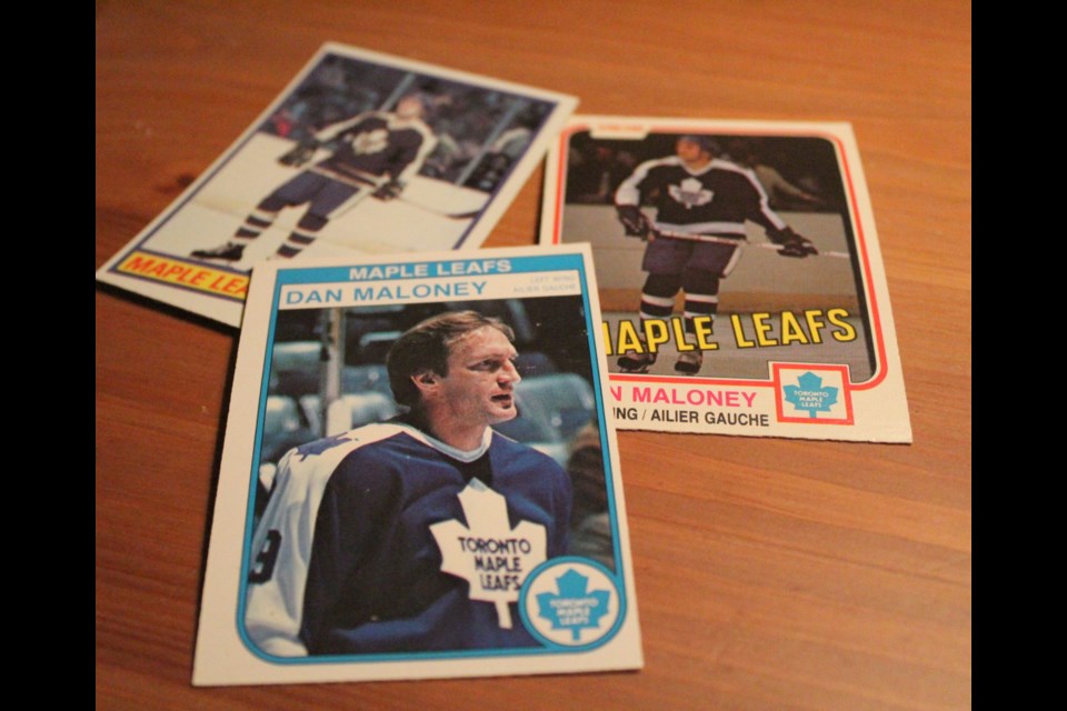 Dan Maloney is shown in a photo illustration featuring some of his hockey cards. Raymond Bowe/BarrieToday
