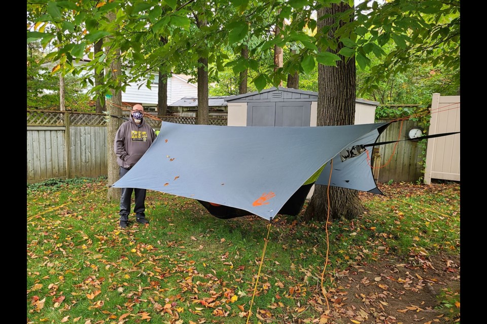Jon Smith with his hammock assembly in his backyard in Barrie. Contributed image