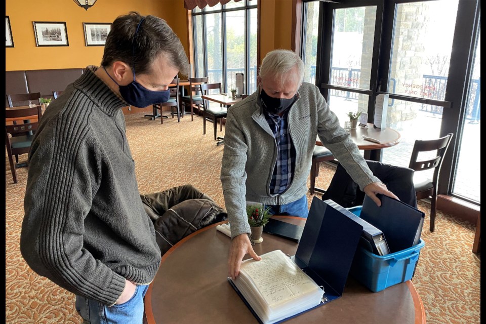 Dave Smart, right, shows some of the wartime letters to Scott Gorman. Supplied photo