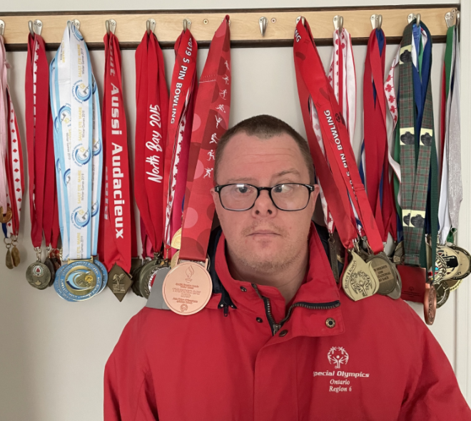 Not only is Trevor Knight a committed YMCA volunteer, but he’s also an accomplished athlete. Pictured here are a few of the medals he’s won for various sports, like floor hockey and skiing, over the years.