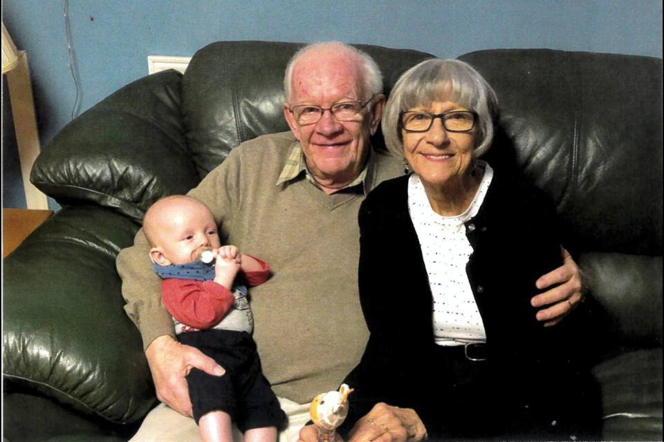 Carl Jory, resident at Woods Park Retirement Residence in Barrie, is a veteran who served as a
mechanic in the air force. He is pictured with his wife, Martha, and their great-grandson. Photo provided