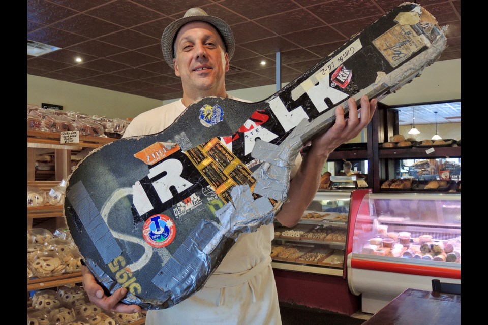  Bruno Alonzi holds the guitar he found in a south end Barrie parking lot that turned out to belong to acclaimed Canadian musician Danny Michel.
Sue Sgambati/BarrieToday        