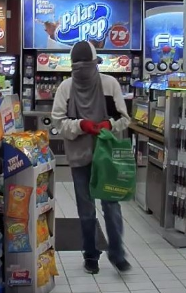 Barrie police have released this surveillance image of a person wanted in connection to a pair of robberies on Dunlop Street East on March 19, 2020. Photo supplied