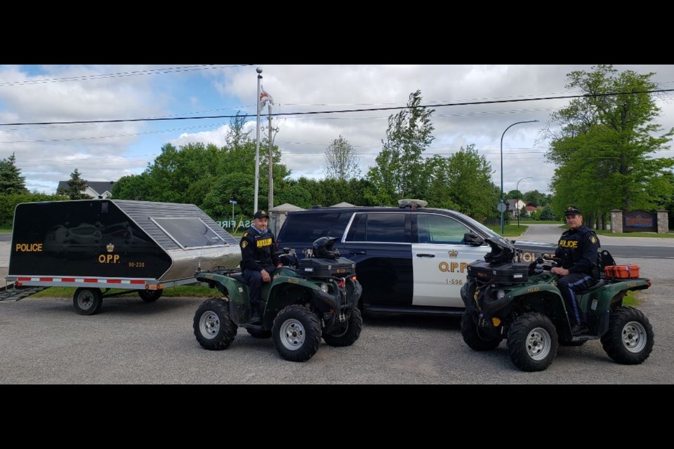 Auxiliary S/Sgt. Andy McDougall and Traffic Unit member David Stephenson on ATV patrol.