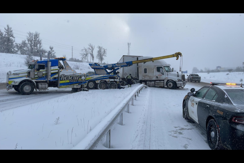 Emergency crews are cleaning up a wreck on Highway 400 near Essa Road after a tractor-trailer went through the guard rail, Tuesday. 
