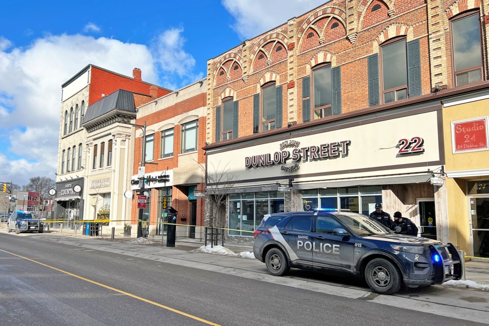 Police have closed off an alleyway and the sidewalk in front of several buildings on Dunlop Street as part of an investigation on Monday morning.