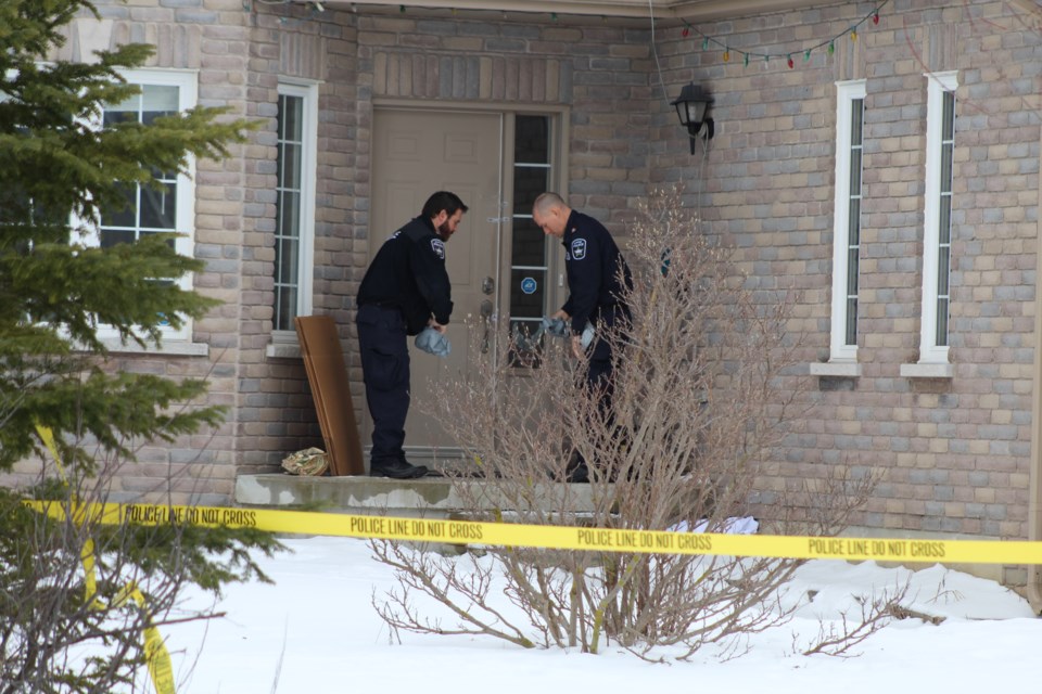 Barrie police forensic identification officers prepare to enter a home on Penvill Trail in the city's south end this afternoon as part of an ongoing murder investigation. A 14-year-old  Raymond Bowe/BarrieToday