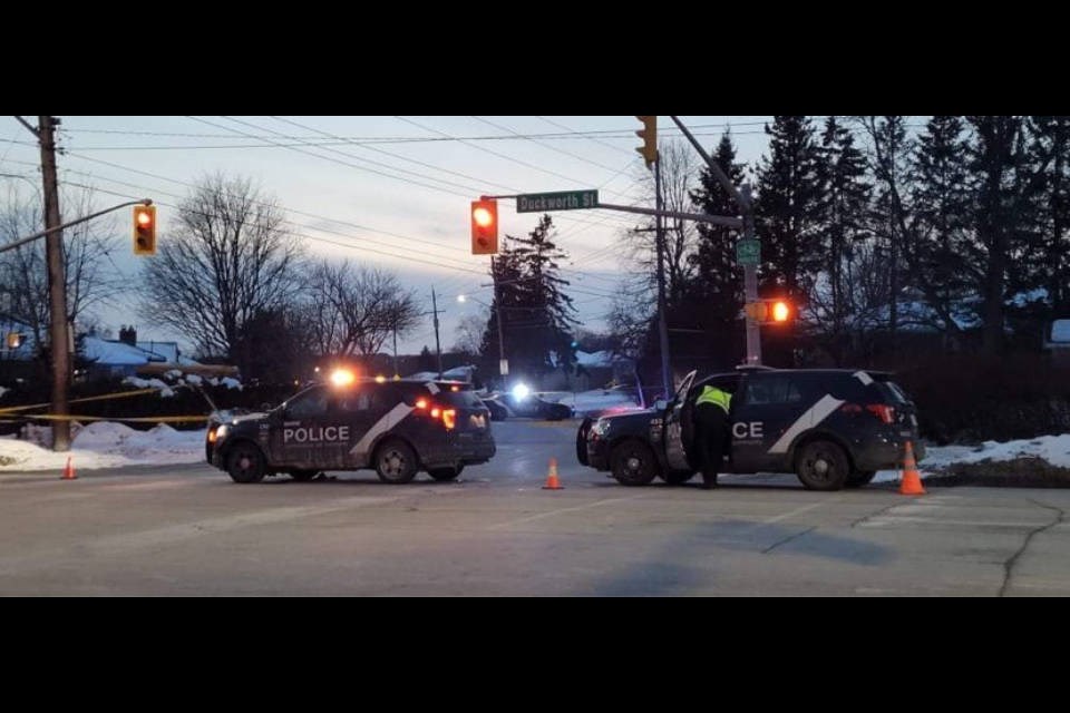 Barrie police at the corner of Grove and Duckworth streets in Barrie on Tuesday night. 