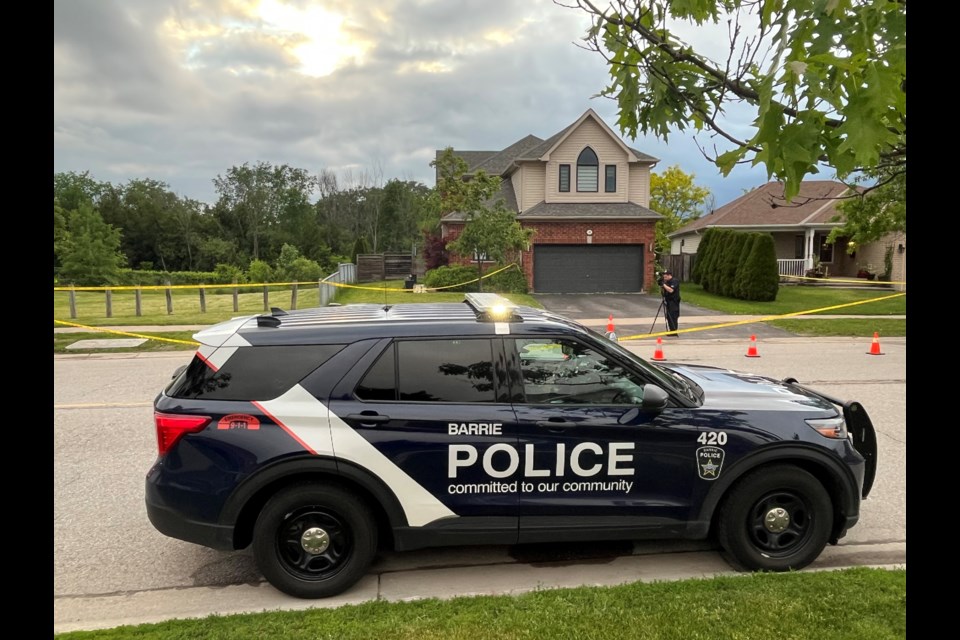 Barrie police collect evidence in front of 46 Country Lane, in the city's south end, following a shooting on Tuesday, June 7, 2022. 