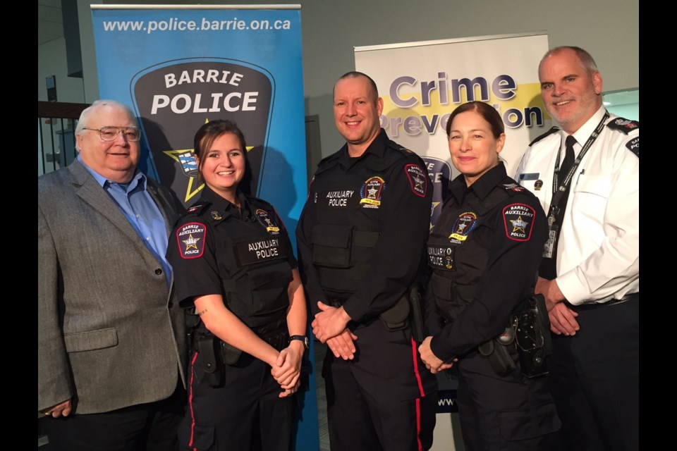 Past and present auxiliary officers left to right retired Auxiliary Insp. Bruce MacGregor, Auxiliary Const. Candice Wilkinson, Auxiliary Const. Brett Morrison, Auxiliary Sgt. Kelly McBride and former Auxiliary and current Barrie Police Staff Sgt. Mark Holden.  Sue Sgambati/BarrieToday
