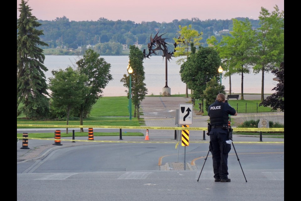 Forensic Identification officer Shannon Green photographs the scene of a shooting in downtown Barrie.
Sue Sgambati/BarrieToday             