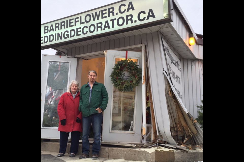 Carol and Rick Tobin stand outside their Dunlop Street flower shop where an alleged impaired driver crashed into the building. Sue Sgambati/BarrieToday