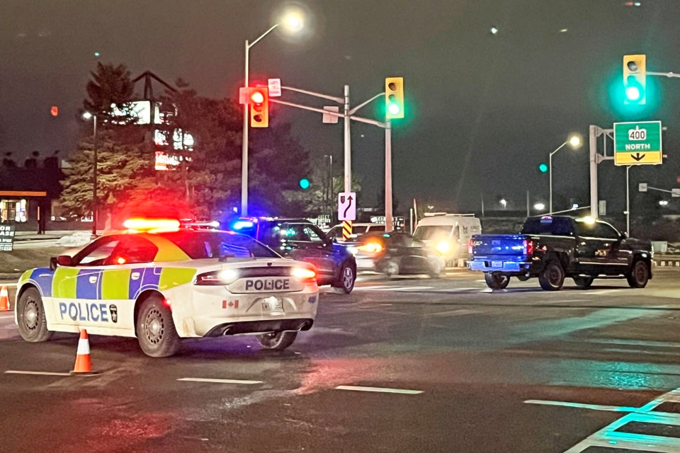 The scene of a crash at Mapleview and Barrie View drives in Barrie on Wednesday night. One pedestrian suffered non-life-threatening injuries.