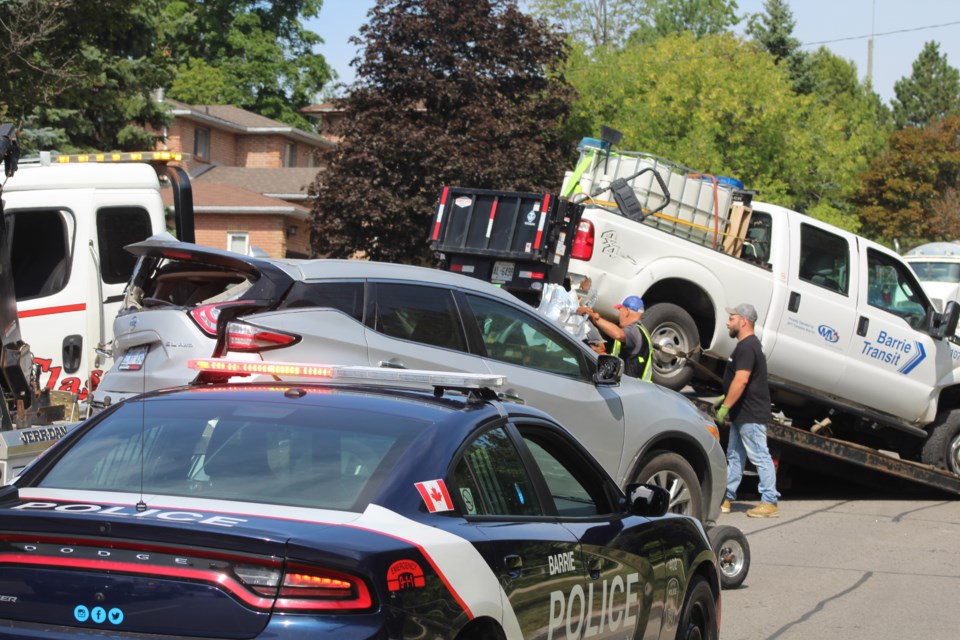 Tow-truck drivers prepare to remove vehicles from a crash scene on Anne Street, Wednesday morning. Raymond Bowe/BarrieToday