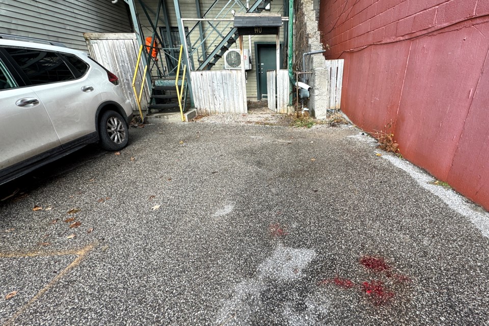 Small pools of blood are all that remain behind a Dunlop Street East building as Barrie police continued their investigation Saturday into a shooting on Friday afternoon. A 59-year-old woman suffered serious injuries after being shot.