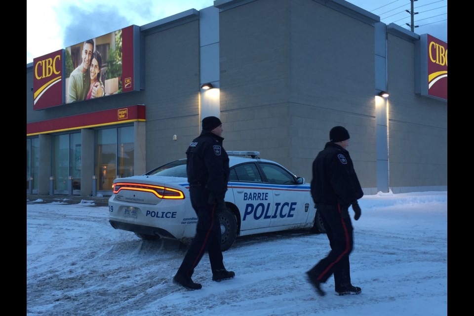 Barrie police officers investigate the scene of a late afternoon robbery. Sue Sgambati/BarrieToday.
