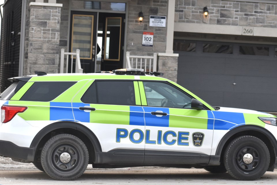 Barrie police during a raid on Madelaine Drive in Barrie's south end on Feb. 8. Cocaine and cash was seized, and a 23-year-old was arrested and charged.