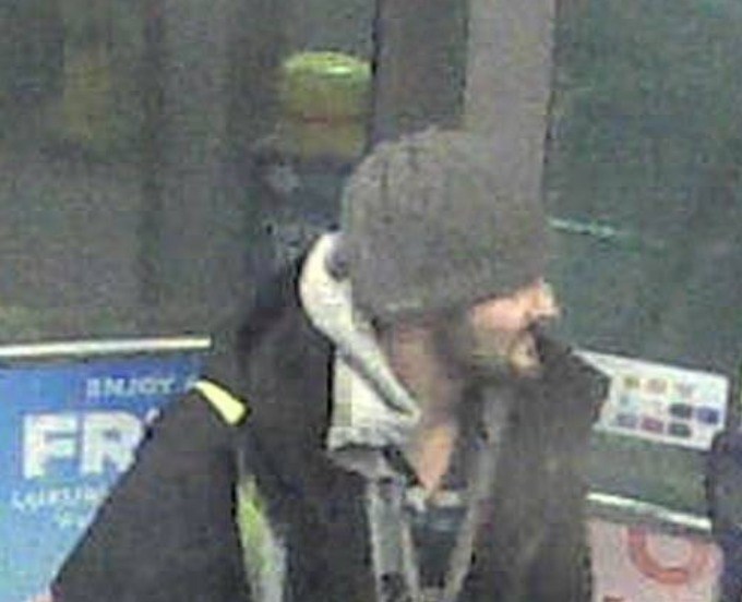 Barrie police investigators released this surveillance image of a man wanted in connection to a theft and fraud case after a stolen debit card was used at an Anne Street North gas station. Photo supplied
